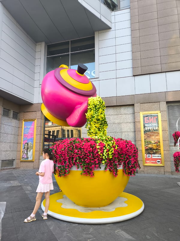 Moscow metro grandeur meets a giant floral teapot sculpture outside