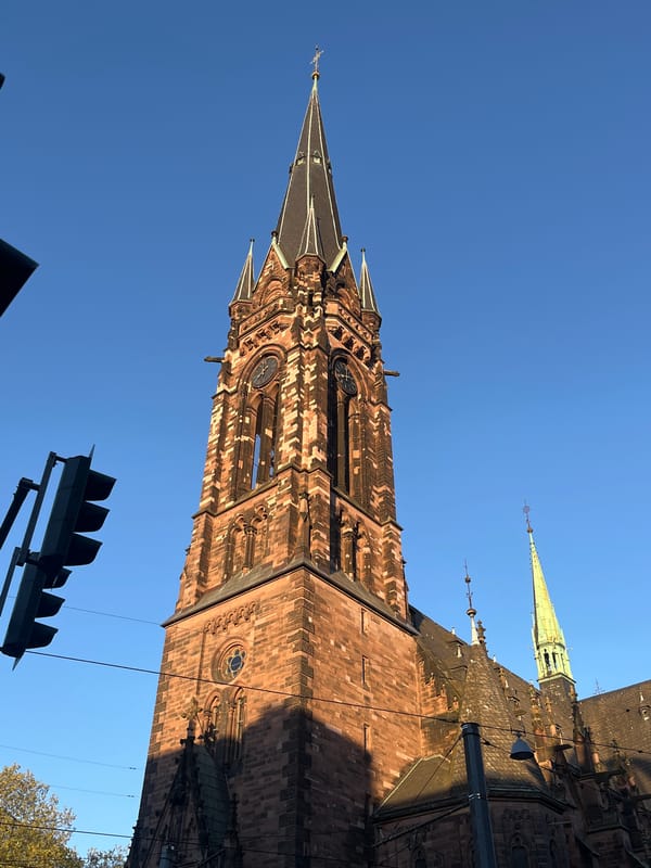 Tourist photographs historic St. Arnual church in Saarbrücken