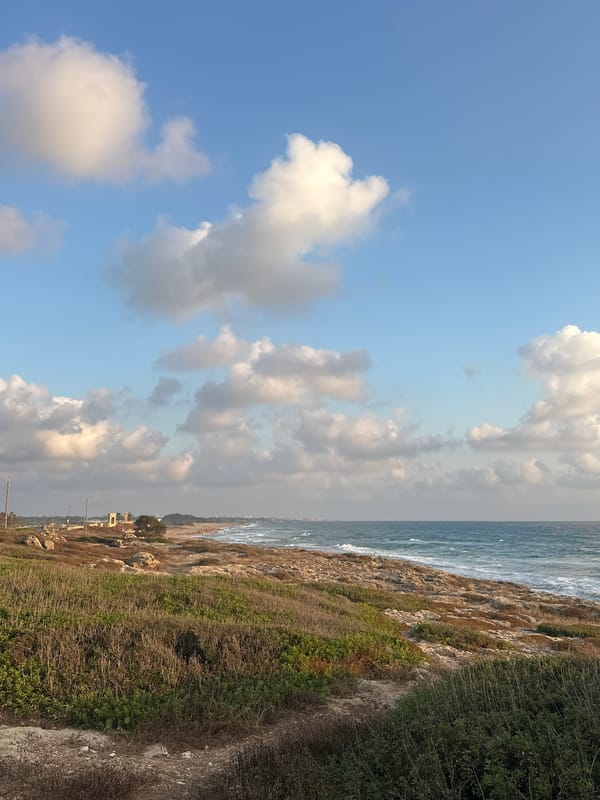 Sunset along a rocky Israeli coastal exercise path