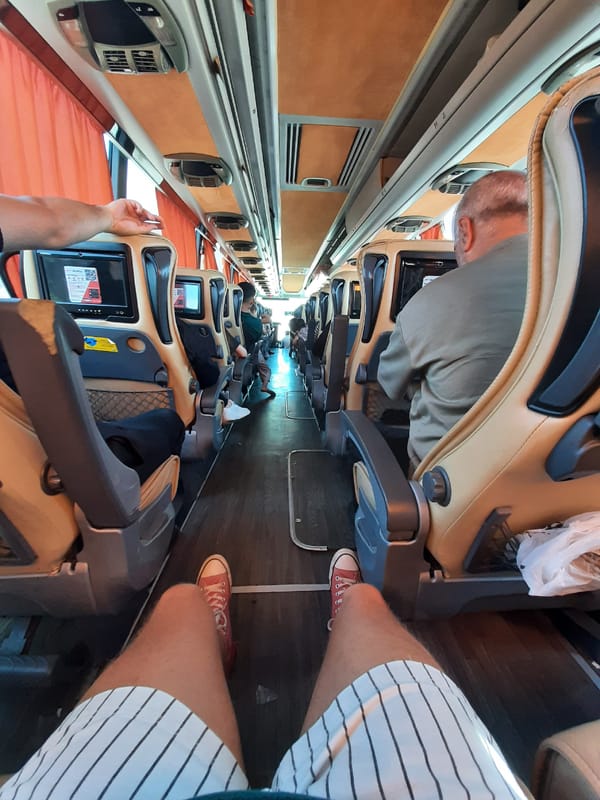 Passengers rest in reclined seats on a Turkish sleeper bus