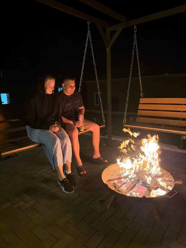 Evening fire pit gathering documented in Kamennoye, Russia