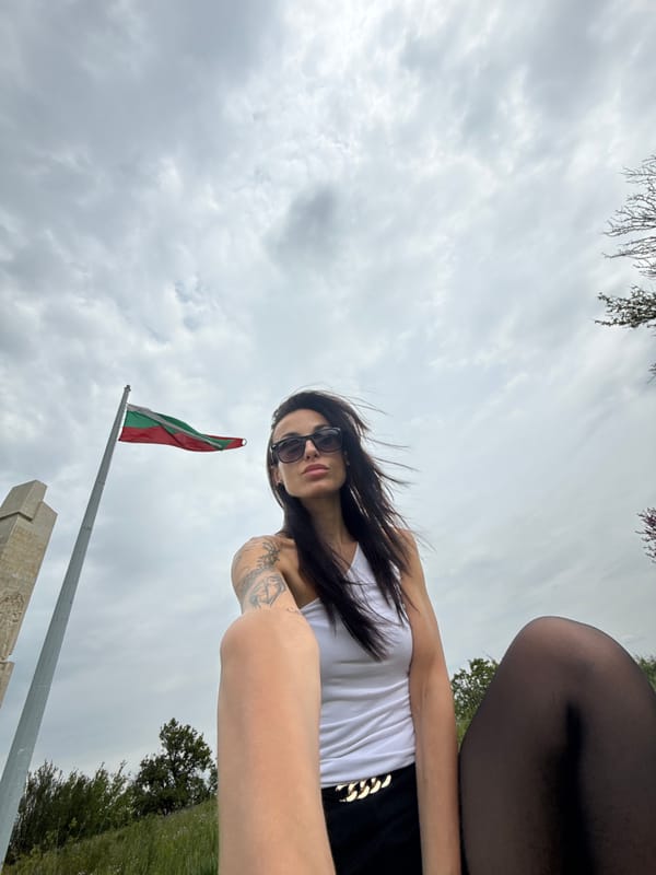 Woman takes selfie on overcast day in Pleven, Bulgaria