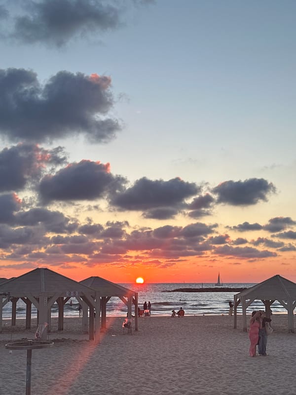 Vibrant sunset observed at Tel-Aviv beach with lifeguard station