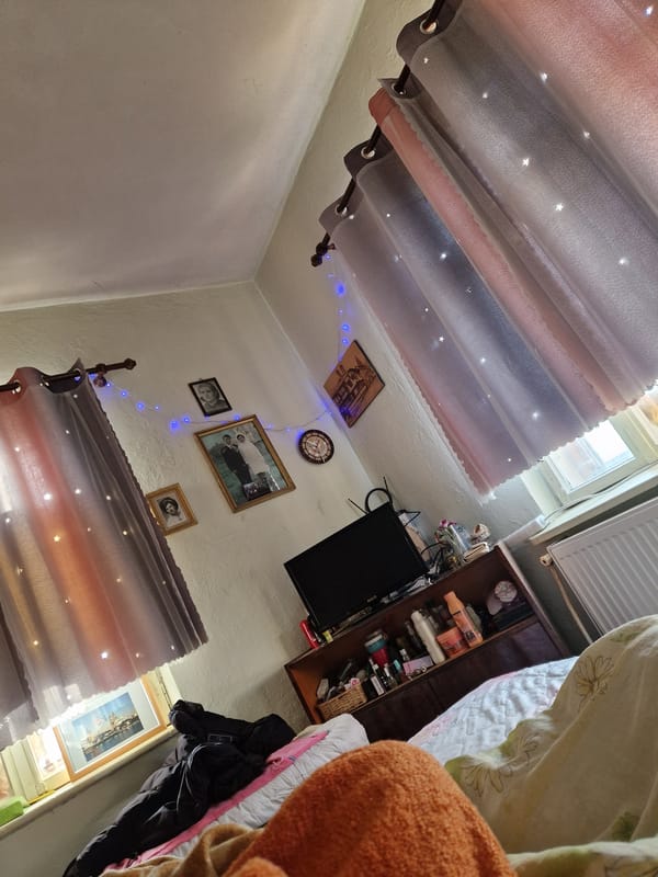 Dawn interior scene captured in Bulgarian bedroom with starlight curtain