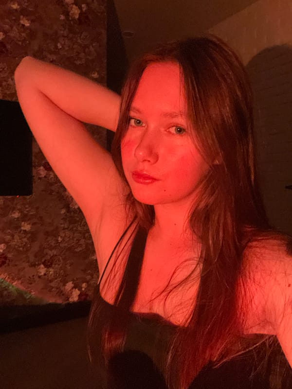 Evening portraits captured under red lighting in Chaikovsky