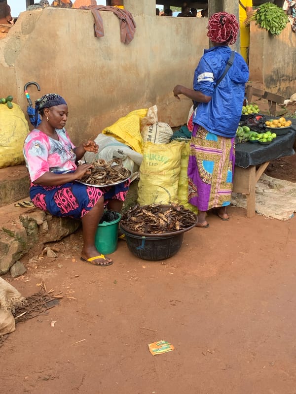 Street life and campaign signage at a Shagamu intersection