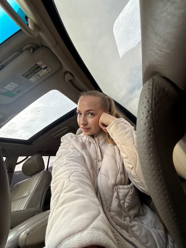 Woman documented moving through Petropavlovsk-Kamchatsky during evening rain