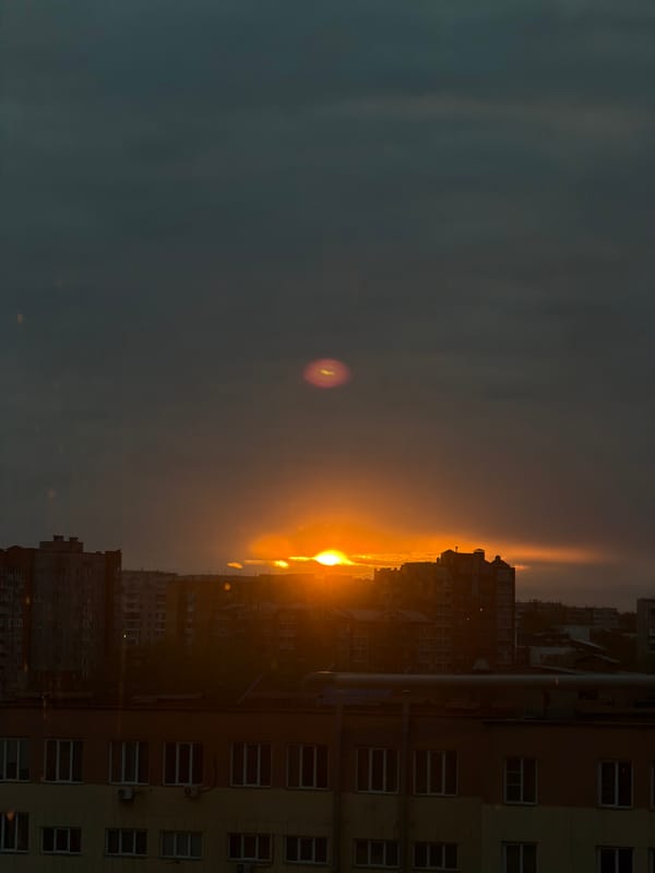 Sunset observed over Krasnoyarsk cityscape from multiple vantage points