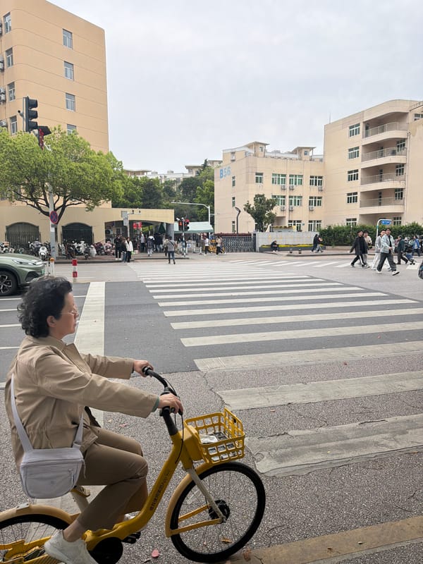 Vehicles block crosswalks as pedestrians navigate Jiangning District intersection