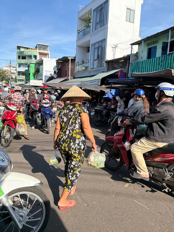 Morning market hustle in Nha Trang, vendors and scooters everywhere