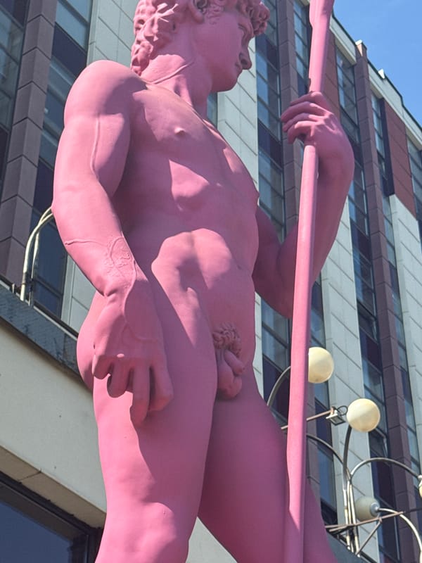 Pink David statue and street bikes in Zhabkino, Russia