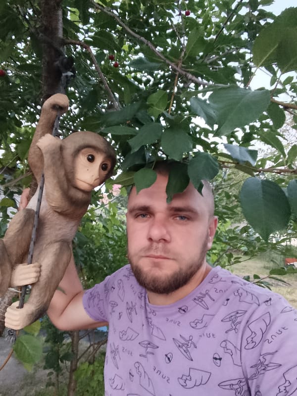 Backyard hangout with monkey statues and a surf tee