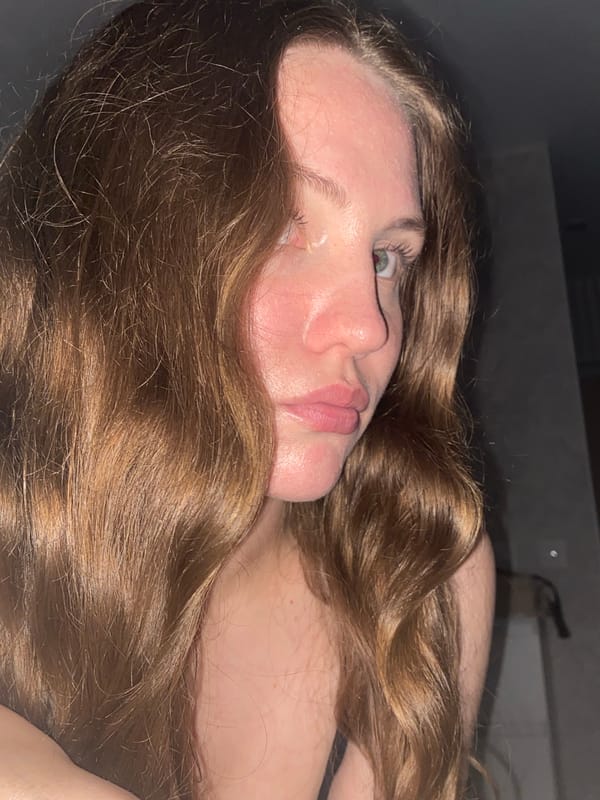 Woman takes selfies in bedroom in Izhevsk, Russia