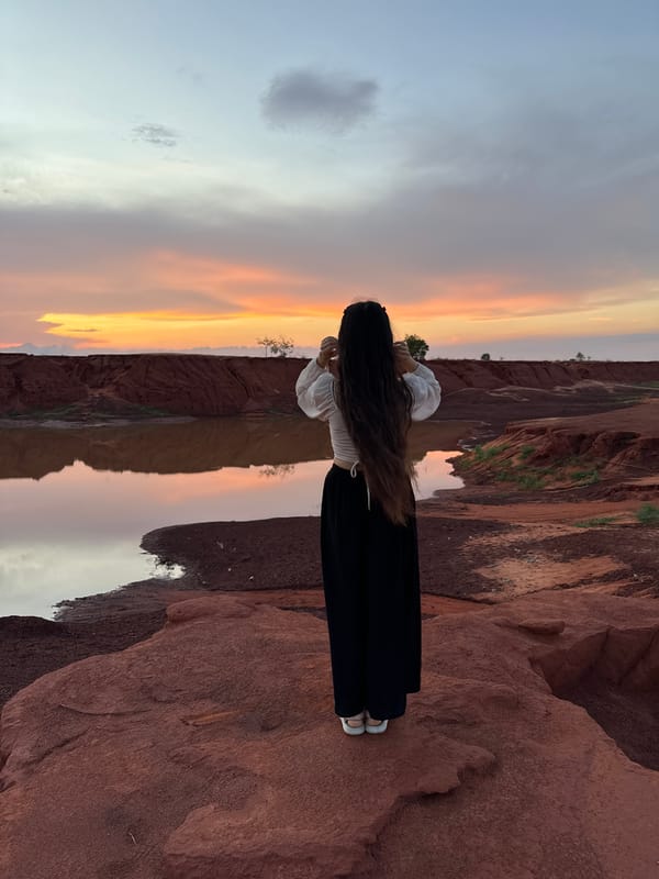 Solitary figure witnesses scenic sunrise/sunset in Mui Ne Vietnam