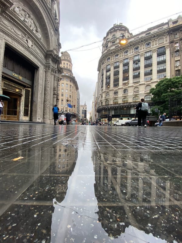 Buenos Aires architectural tour captured in wet-street reflections