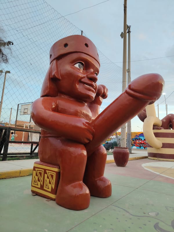 Child visits Mochica warrior statue display in Trujillo plaza