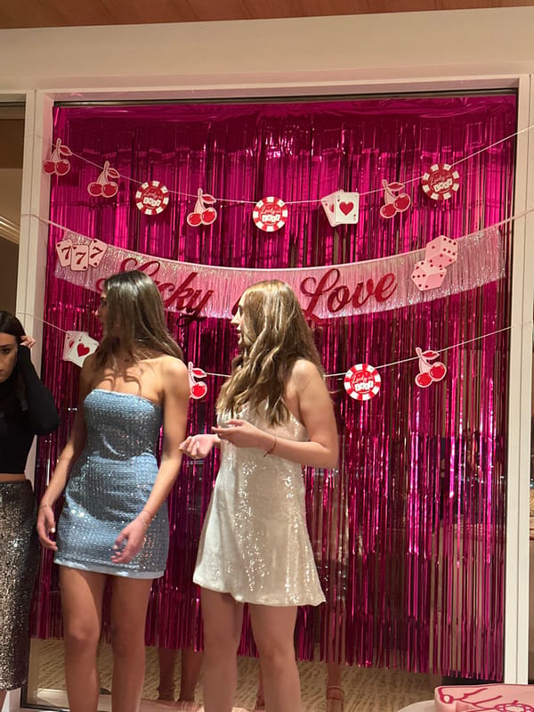 Women pose at casino-themed "Lucky in Love" display in Las Vegas