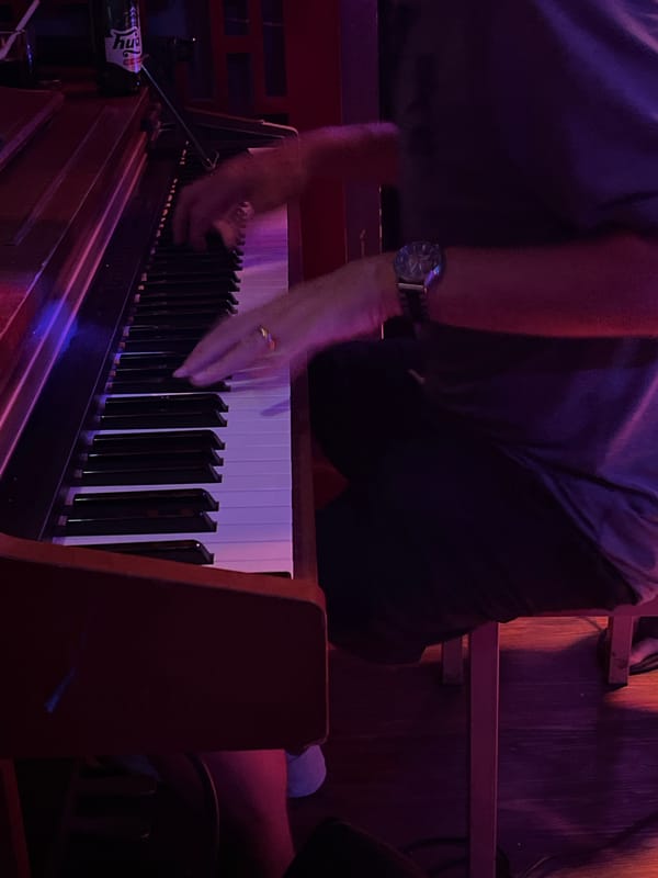 Musical performance featuring piano and vocals in Đà Nẵng