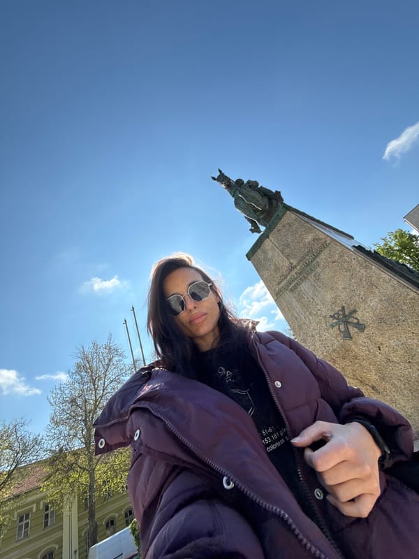 Woman photographs herself at Broken Chains monument in Pleven