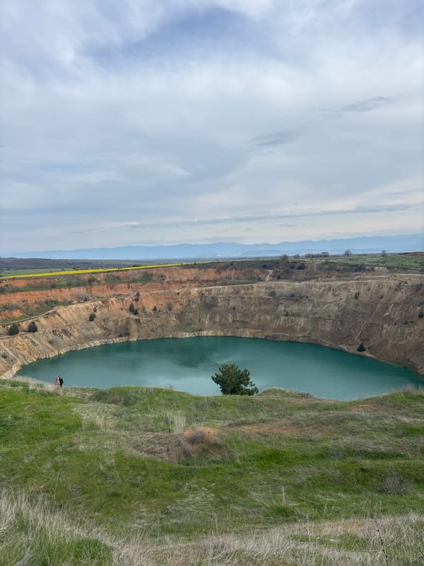 Young visitors photograph themselves at Emerald Lake quarry, Bulgaria