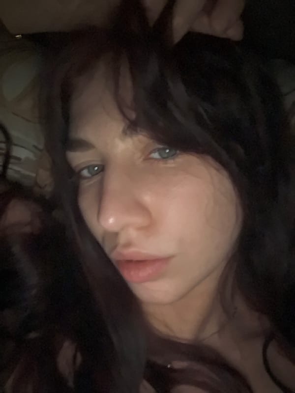 Close-up portrait captured in dim lighting conditions