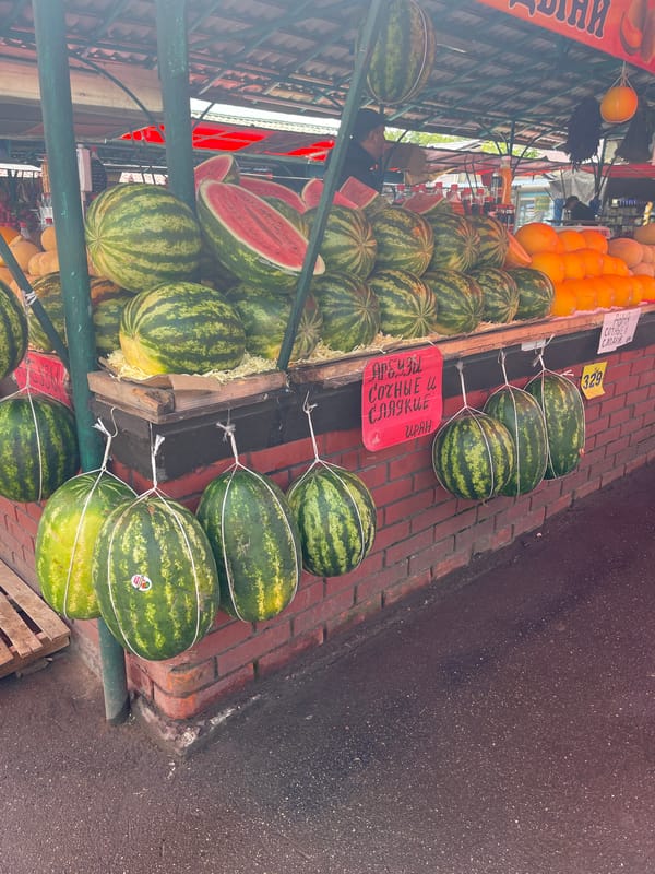 Street market fruit stand documented with Russian pricing