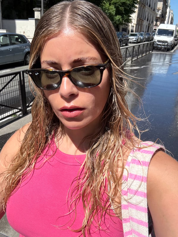 Woman with wet hair photographed on Paris street