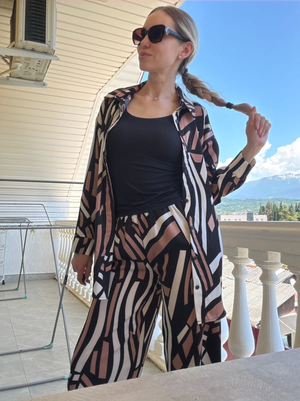 Balcony selfies with Sochi's mountain cityscape behind