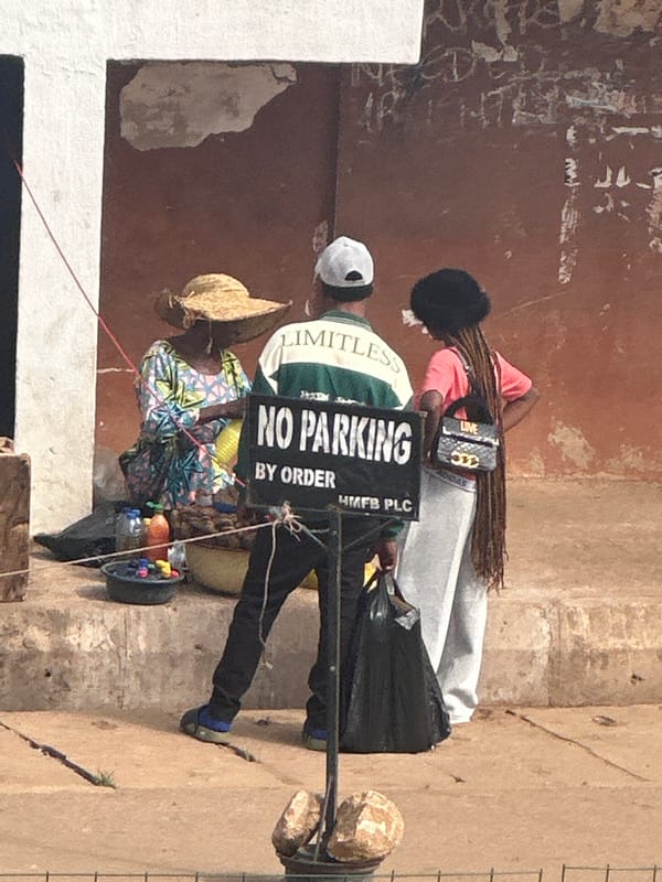 Weekday morning foot traffic and commerce in Bukuru's streets