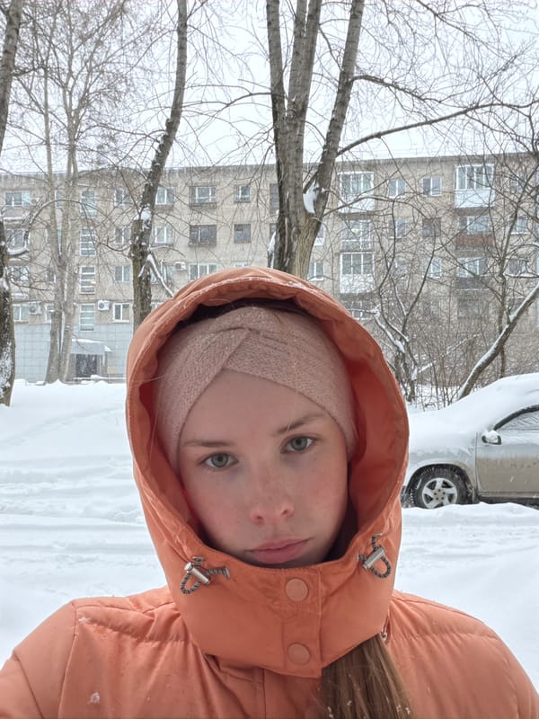 Woman photographed during snowfall in Berezniki, Russia