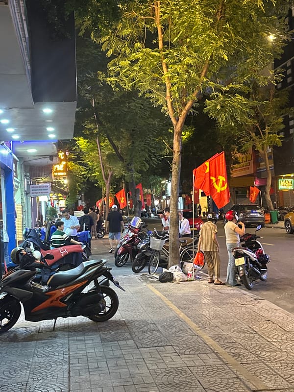 Thủ Đức nightlife: busy streets, neon signs, and motorbike traffic