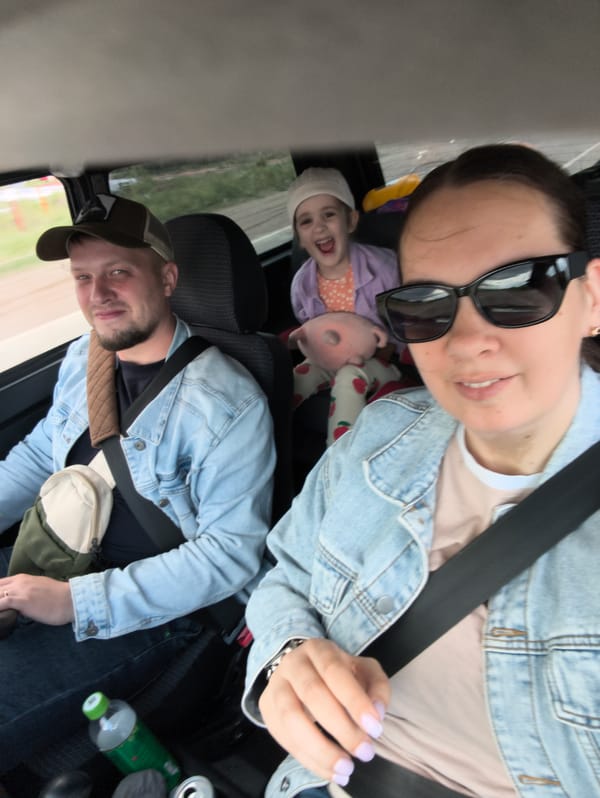 Three people photographed inside vehicle in Chaikovsky, Russia
