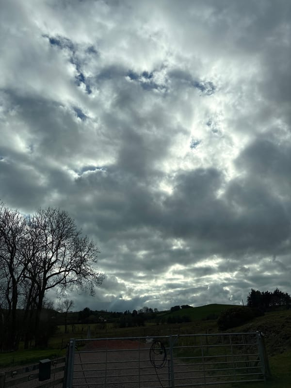 Dramatic overcast skies observed over Minsterley countryside