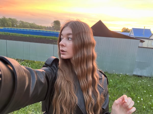 Woman takes selfies outdoors in rural Russian village