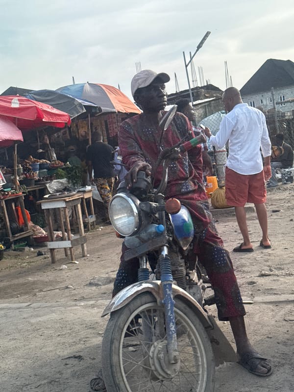 Men photographing and motorcycling in Lekki, Nigeria