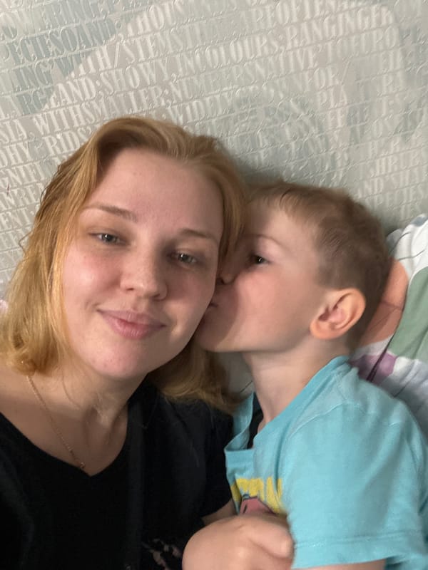 Mother and child share quiet domestic afternoon in Rusanovo