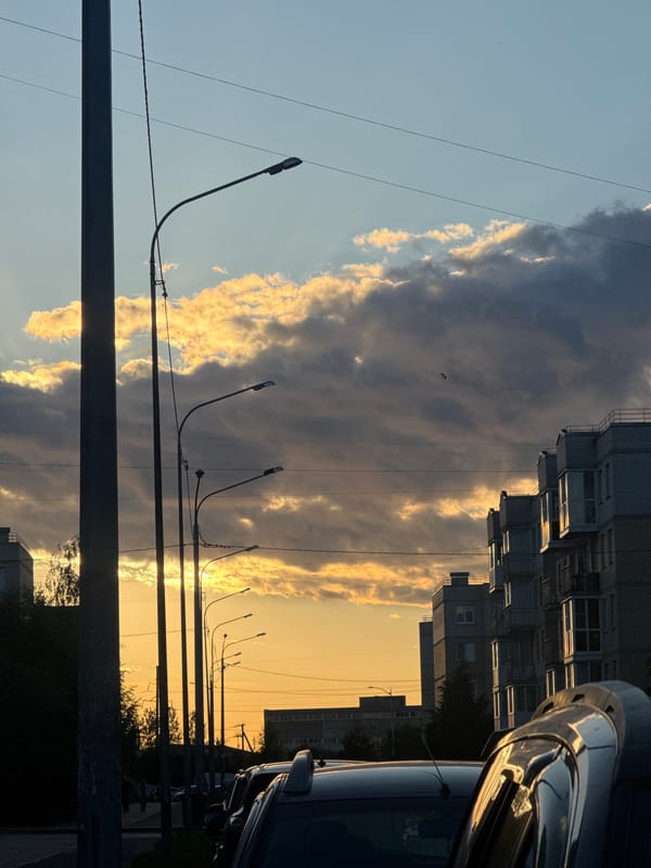 Sunset clouds over Shushary streets, golden light and silhouettes
