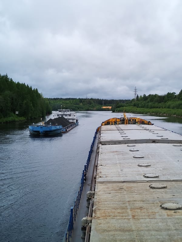 Coal barges navigate Russian river near Depo