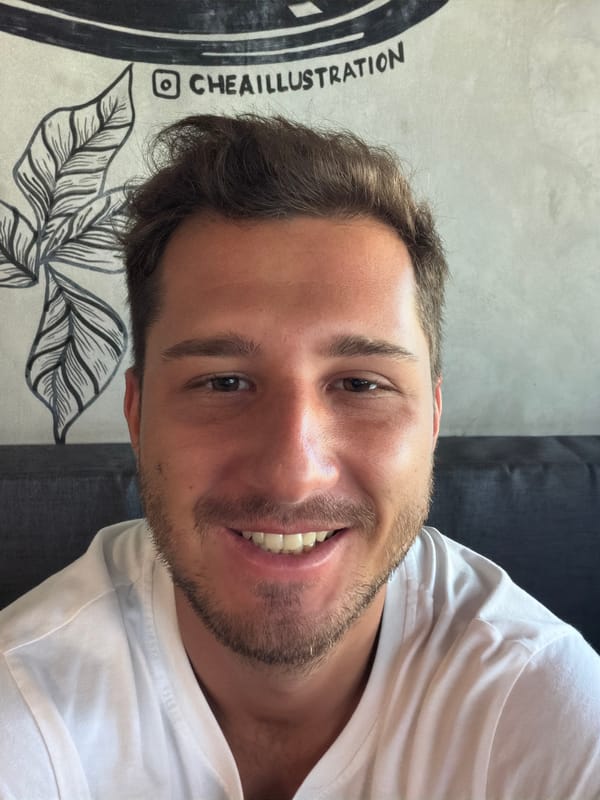 Young man enjoys coffee at Indonesian cafe in Kerobokan