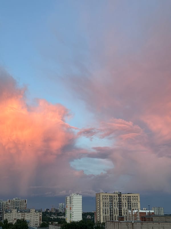 Sunset observed over Izhevsk cityscape with colorful clouds