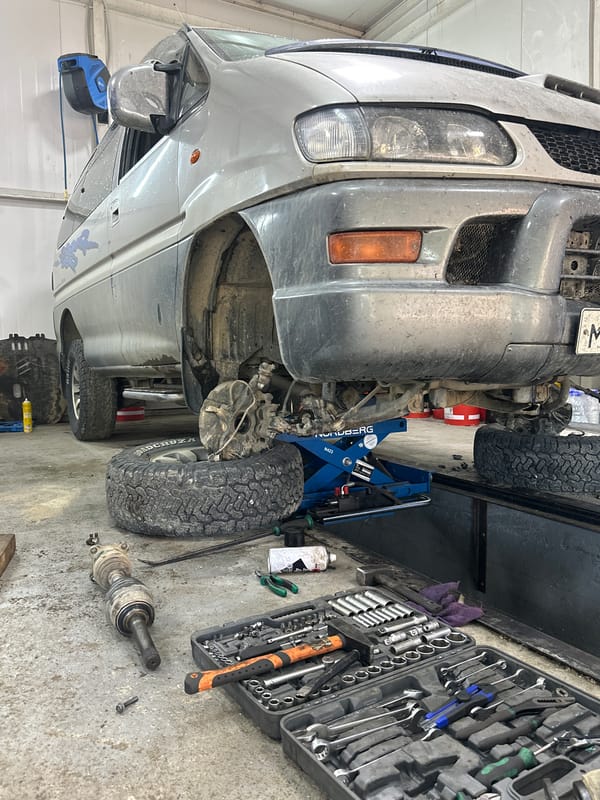 Auto repair shop in Blagoveshchensk, multiple vehicles on lifts