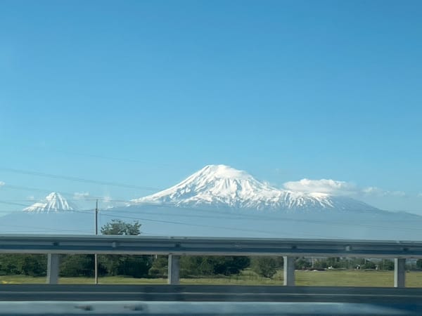 Mount Ararat reflection captured in vehicle windshield near Parpi