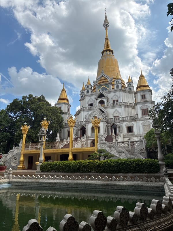 Ornate Buddhist temple with golden stupas in Dĩ An, Vietnam