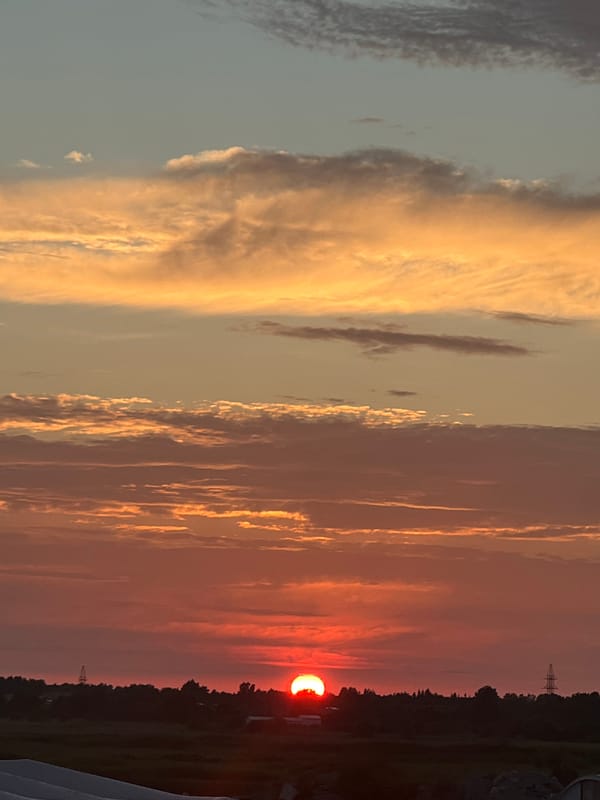 Vivid summer sunset over rural Nasva alevik, Estonia