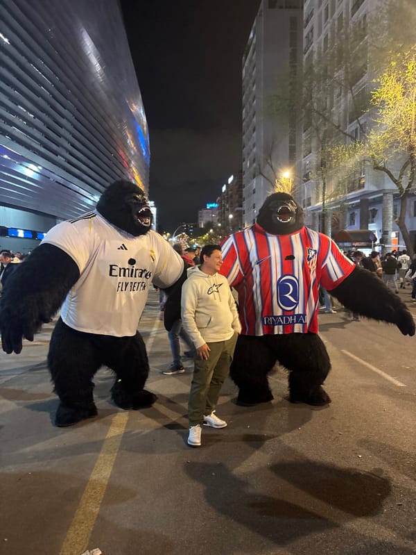 Crowd gathers at Santiago Bernabéu Stadium with police present