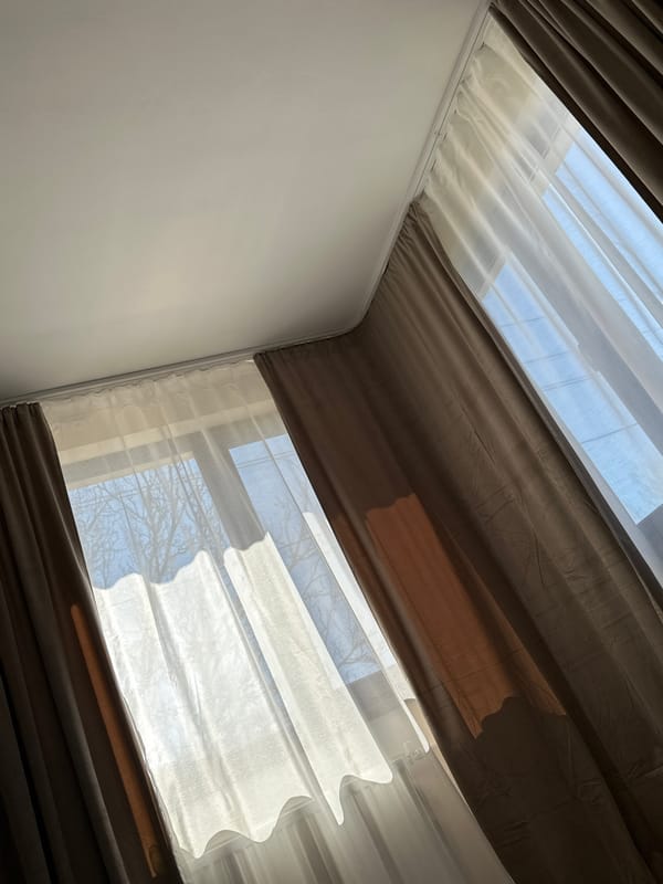 Room interior with layered curtains documented in Galiche, Bulgaria