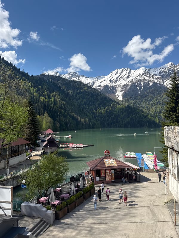 Visitor documents scenic Lake Ritsa views in Abkhazia