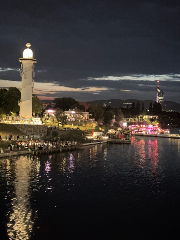 Vienna's Danube Canal lighthouse glowing at night
