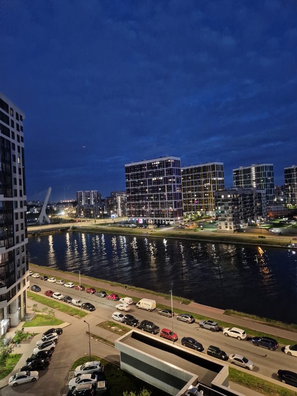 City waterfront dusk views paired with a cozy fireplace balcony