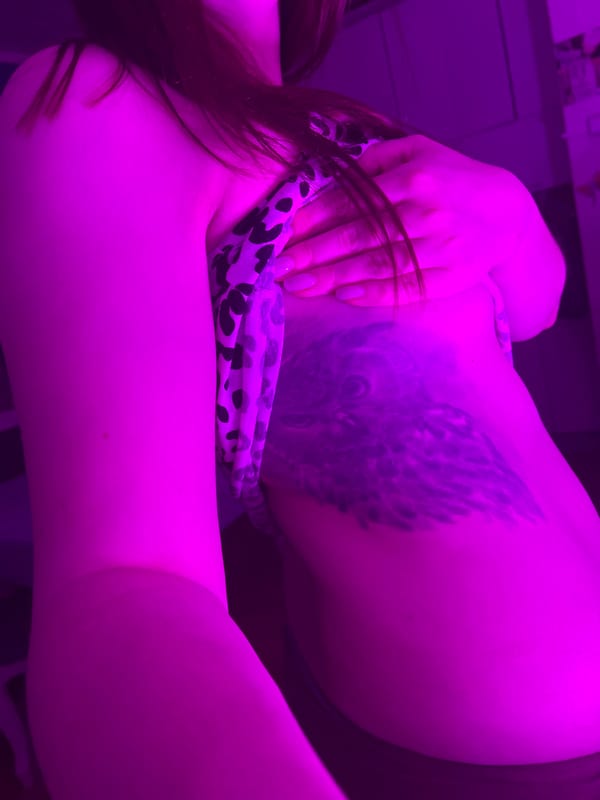 Woman photographed in leopard print with tattoos in Russia